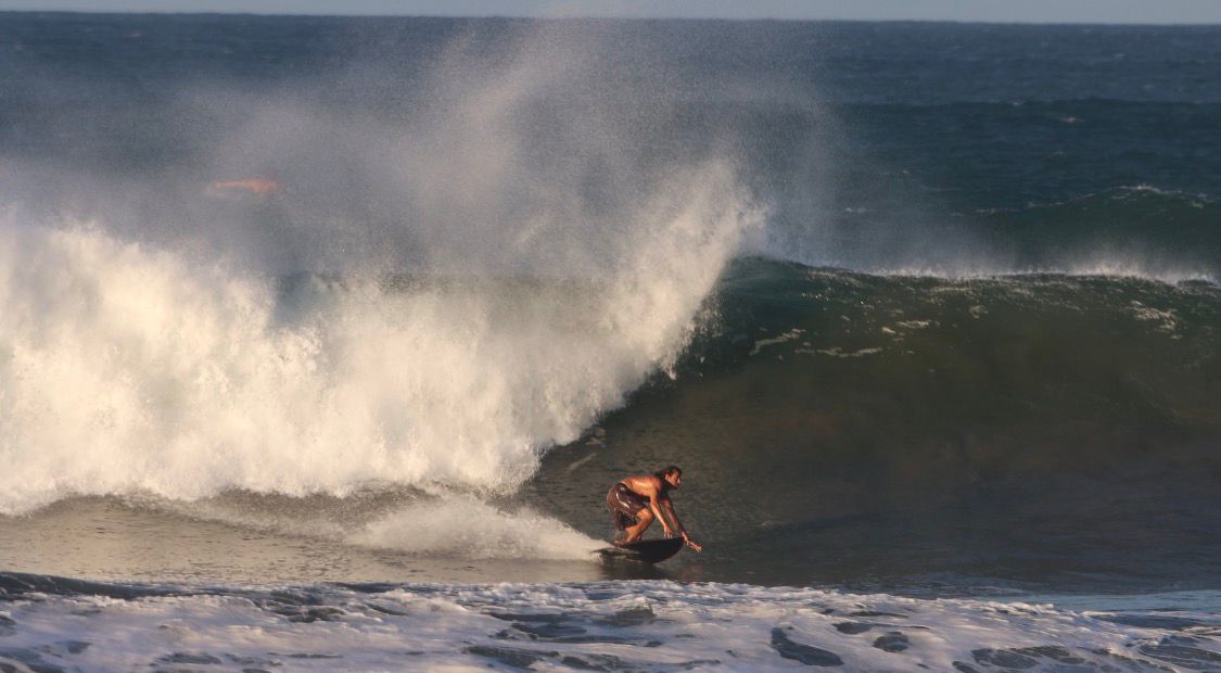 Powerful wave with surfer at Nosara