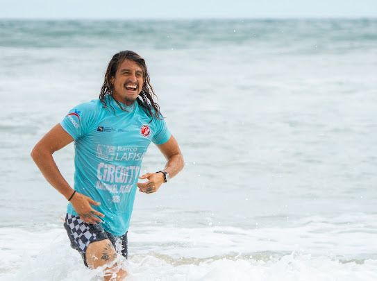 Chelo celebrating after a heat at a national surf competition